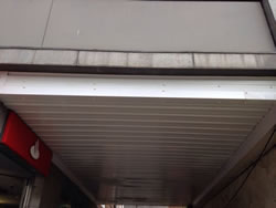 Cladding of an underpass using preformed sheeting.